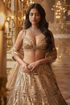 Shop_Seema Gujral_Gold Net Embroidered Sequins Sweetheart Bridal Lehenga Set _Online_at_Aza_Fashions