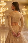 Seema Gujral_Gold Net Embroidered Pearls Deep V Neck And Beads Work Bridal Lehenga Set _Online_at_Aza_Fashions