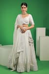 Buy_Kohsh_White Georgette Embroidered Thread V-neck Mukaish Floral Lehenga Set  _at_Aza_Fashions