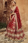 Buy_Annus Creation_Red Silk Embroidered Cutdana Leaf Bridal Lehenga Set_at_Aza_Fashions