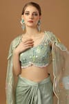 Shop_Merge Design_Green Net, Organza, Modal, Satin Stones, Draped Skirt Set With Floral Shrug _at_Aza_Fashions