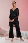 Buy_SWATI WADHWANI COUTURE_Black Net Embroidered Sequin V Neck Peplum Jacket Pant Set  _at_Aza_Fashions