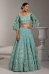 Buy_SWATI WADHWANI COUTURE_Blue Net Embroidered Sequin Sweetheart Lehenga With Floral Applique Work Blouse _at_Aza_Fashions