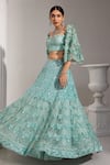 Shop_SWATI WADHWANI COUTURE_Blue Net Embroidered Sequin Sweetheart Lehenga With Floral Applique Work Blouse _at_Aza_Fashions