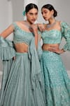 SWATI WADHWANI COUTURE_Blue Net Embroidered Sequin Sweetheart Lehenga With Floral Applique Work Blouse _Online_at_Aza_Fashions