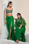 SWATI WADHWANI COUTURE_Green Net Georgette Embroidered Pre-draped Saree Feather Cape Set _at_Aza_Fashions