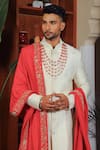 YAJY by Aditya Jain_Ivory Silk Embroidery Thread Paisley And Floral Sherwani Set _Online