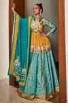 Buy_The Royaleum_Green Silk, Crepe Mirrors, Beads Triya Bandhani Print Lehenga Set _at_Aza_Fashions