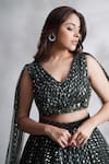 Shop_Chaashni By Maansi And Ketan_Green Net Sequins, Stones, Cut Work V-neck Embroidered Lehenga And Blouse Set _Online_at_Aza_Fashions