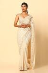Buy Meenagurnam Ivory Shimmer Chinnon Embroidery Tonal Floral Beaded Border Saree With Blouse at Aza Fashions Buy_Meenagurnam_Ivory Shimmer Chinnon Embroidery Tonal Floral Beaded Border Saree With Blouse _at_Aza_Fashions