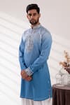 Tira by Naresh Raj_Blue Raw Silk Embroidered Paisley Bloom Bundi Kurta Set  _at_Aza_Fashions