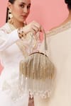 Buy_THE TAN CLAN_Gold Hand Embroidered Amour Tassel Batua Bag _at_Aza_Fashions