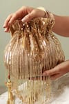 Shop_THE TAN CLAN_Gold Beads Twinkle Tassels Potli _Online_at_Aza_Fashions