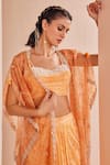 Shop_Mandira Wirk_Orange Chiffon Printed Abstract Sweetheart Pattern Cape Skirt Set _at_Aza_Fashions