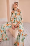 Shop_Mandira Wirk_Green Chiffon Printed Floral Halter Draped Jumpsuit_Online_at_Aza_Fashions