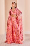 Buy_Mandira Wirk_Pink Chiffon Printed Striped Blouse V Neck Sharara Set With Floral Pattern Cape _at_Aza_Fashions