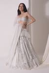 Buy_Shwetanga_White Crepe Embellished Sequin Asymmetric Layered Lehenga Bustier Set _at_Aza_Fashions
