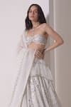 Shop_Shwetanga_White Crepe Embellished Sequin Asymmetric Layered Lehenga Bustier Set _at_Aza_Fashions