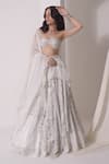 Shwetanga_White Crepe Embellished Sequin Asymmetric Layered Lehenga Bustier Set _at_Aza_Fashions