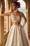 Shop_LASHKARAA_White Brocade Embroidery Thread Square Floral Chevron Pattern Bridal Lehenga Set_at_Aza_Fashions