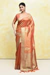 Buy_Samyukta Singhania_Orange Tissue Woven Flower Plunge V Neck Saree With Blouse _at_Aza_Fashions