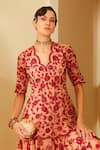 Shop_Sachkiran Bimbra_Peach Satin Printed And Embroidered Rose V Amber Skirt & Peplum Kurta Set_at_Aza_Fashions