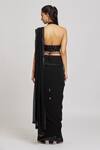 Shop_Nitisha Kashyap Official_Black Silk, Net, Georgette Embroidered Border Pre-draped Saree With Blouse _at_Aza_Fashions