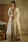 Buy_Mehak Murpana_Ivory Net Embroidered Sequin V-neck Floral Bridal Lehenga Set _at_Aza_Fashions