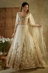 Shop_Mehak Murpana_Ivory Net Embroidered Sequin V-neck Floral Bridal Lehenga Set _Online_at_Aza_Fashions