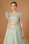 Shop_Merge Design_Green Georgette, Net Pearls, Stones, Sequins Applique Embroidered Lehenga Set _at_Aza_Fashions