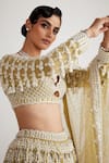Vvani By Vani Vats_Green Georgette, Net Pearls Scalloped Chandelier Embellished Bridal Lehenga Set _at_Aza_Fashions