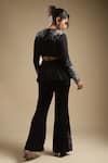 Shop Sakshi Khetterpal Black Georgette Embroidery Sequin V Neck Peplum Top And Bell Bottom Pant Set at Aza Fashions Shop_Sakshi Khetterpal_Black Georgette Embroidery Sequin V Neck Peplum Top And Bell Bottom Pant Set _at_Aza_Fashions