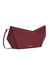 Shop_ADISEE_Maroon Plain Abstract Structured Leather Clutch _at_Aza_Fashions