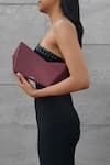 Shop_ADISEE_Maroon Plain Abstract Structured Leather Clutch _Online_at_Aza_Fashions