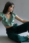 Buy_Kritika Madan Label_Green Turkey Crepe Plain V Neck Ruffle Crop Top And Pant Set  _Online_at_Aza_Fashions