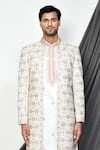 Aryavir Malhotra_Cream Sherwani And Kurta Tuxedo Satin Embroidery Thread Floral & Set _at_Aza_Fashions