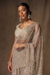 Shop_tara thakur_Beige Butterfly Net Hand Embroidered Floral Pre-draped Saree With Blouse _Online_at_Aza_Fashions