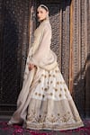 tara thakur_Ivory Silk Embroidered Floral Deep V Neck Lehenga Set  _Online_at_Aza_Fashions