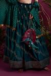 tara thakur_Green Brocade Embroidered Kiran V-neck Woven Zari Lehenga Butti Jacket Set _Online_at_Aza_Fashions