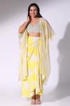 Buy_Sakshi Girri_Yellow Crepe Printed Floral Leaf Draped Skirt Cape Set _at_Aza_Fashions