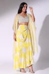 Shop_Sakshi Girri_Yellow Crepe Printed Floral Leaf Draped Skirt Cape Set _at_Aza_Fashions