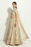 Vandana Sethi Ivory Silk Pearls, Tassels, Zardozi Embroidered Paisley Bridal Lehenga Set at Aza Fashions Vandana Sethi_Ivory Silk Pearls, Tassels, Zardozi Embroidered Paisley Bridal Lehenga Set _at_Aza_Fashions