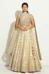 Buy_Vandana Sethi_Ivory Raw Silk Embroidered Mirrorwork V-neck Scalloped Pattern Lehenga Set _at_Aza_Fashions