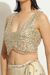 Vandana Sethi_Ivory Raw Silk Embroidered Mirrorwork V-neck Scalloped Pattern Lehenga Set _at_Aza_Fashions