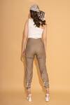 Shop_Torqadorn_Beige Polyester Ribbons Tie-up Panel Rivet Pant_at_Aza_Fashions