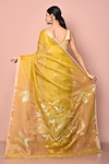 Shop_Nazaakat by Samara Singh_Yellow Pure Tissue Silk Woven Floral Saree With Running Blouse Piece_at_Aza_Fashions