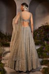 Shop_Charu and Vasundhara_Silver Net Hand Embroidered Stone Leaf Neck Lily Bead Bridal Lehenga Set_Online_at_Aza_Fashions