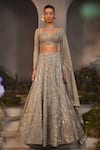 Buy_Charu and Vasundhara_Silver Net Hand Embroidered Sequin Leaf Neck Lilian Bridal Lehenga Set _at_Aza_Fashions