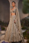 Charu and Vasundhara_Silver Net Hand Embroidered Sequin Leaf Neck Lilian Bridal Lehenga Set _Online_at_Aza_Fashions