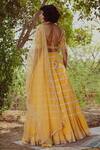 Shop_Irrau by Samir Mantri_Yellow Net Embroidered Thread Work V Neck Stripe Lehenga Set _at_Aza_Fashions